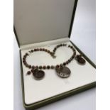 A jasper and Jurassic Fossil Ammonites (163 million years old) necklace and matching earrings from