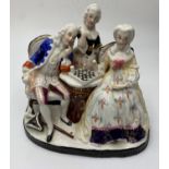 Ceramic statue of a Dandy Playing chess with his lady admirers, 10x14cm