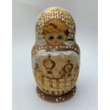 Handmade wooden Russian doll, containing a further 4 dolls inside , 13cm tall