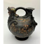 Decorated Egyptian style wine jug, 13cms tall.