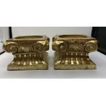 A pair of heavy baroque scrolled plinths. 10x10cms and 8cms high.