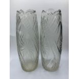 A pair of cut glass vases, 26cms tall