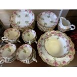 A Chapman England Floral Bone China Tea set, comprising of 11 cups and saucers, 12 side plates and 2