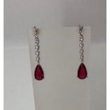 Pair of Silver drop Earrings with Pear shaped red CZ stones, weight 5.2g and 3.9mm long approx (