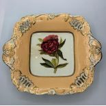 H&R Daniel shell pierces shape oblong dish, with double red peony centre.