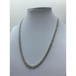 18ct white gold necklace with 10ct of graduated stones, weight 16.73g and 42cm long