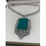 A dress necklace with lab created emerald (36x25mmm) and sapphires marked 18KGL, designed and signed