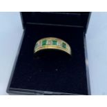 Stone Set Gold Ring Having Emeralds and Diamonds to Top in a Half Eternity Type Setting. 9 Carat