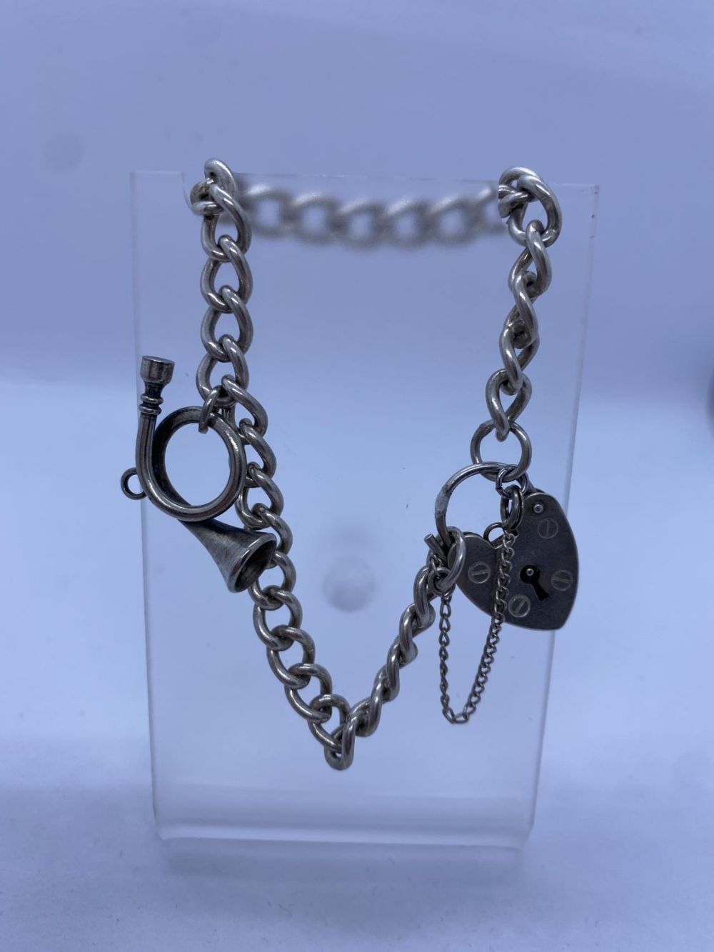 Silver Bracelet with Bugle Charm & Heart Padlock, 17.6g, 18cms.