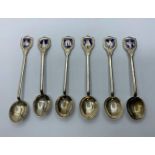 6 silver honey spoons with Indian cities and emblems on handles.