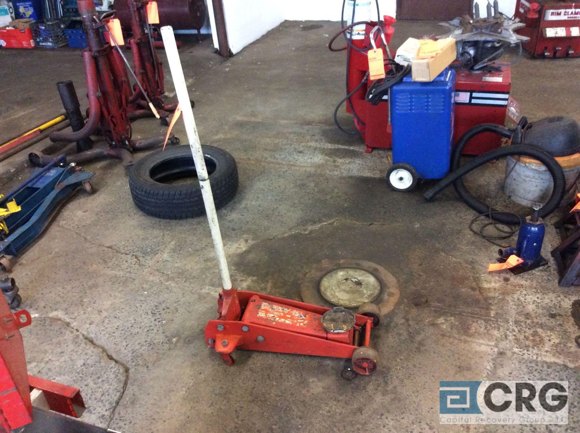 Mfg unknown, portable hydraulic floor jack, 2 ton capacity.