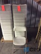 Lot of (50) beige metal / plastic folding stack chairs