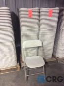 Lot of (50) beige metal / plastic folding stack chairs