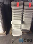 Lot of (50) beige metal / plastic folding stack chairs