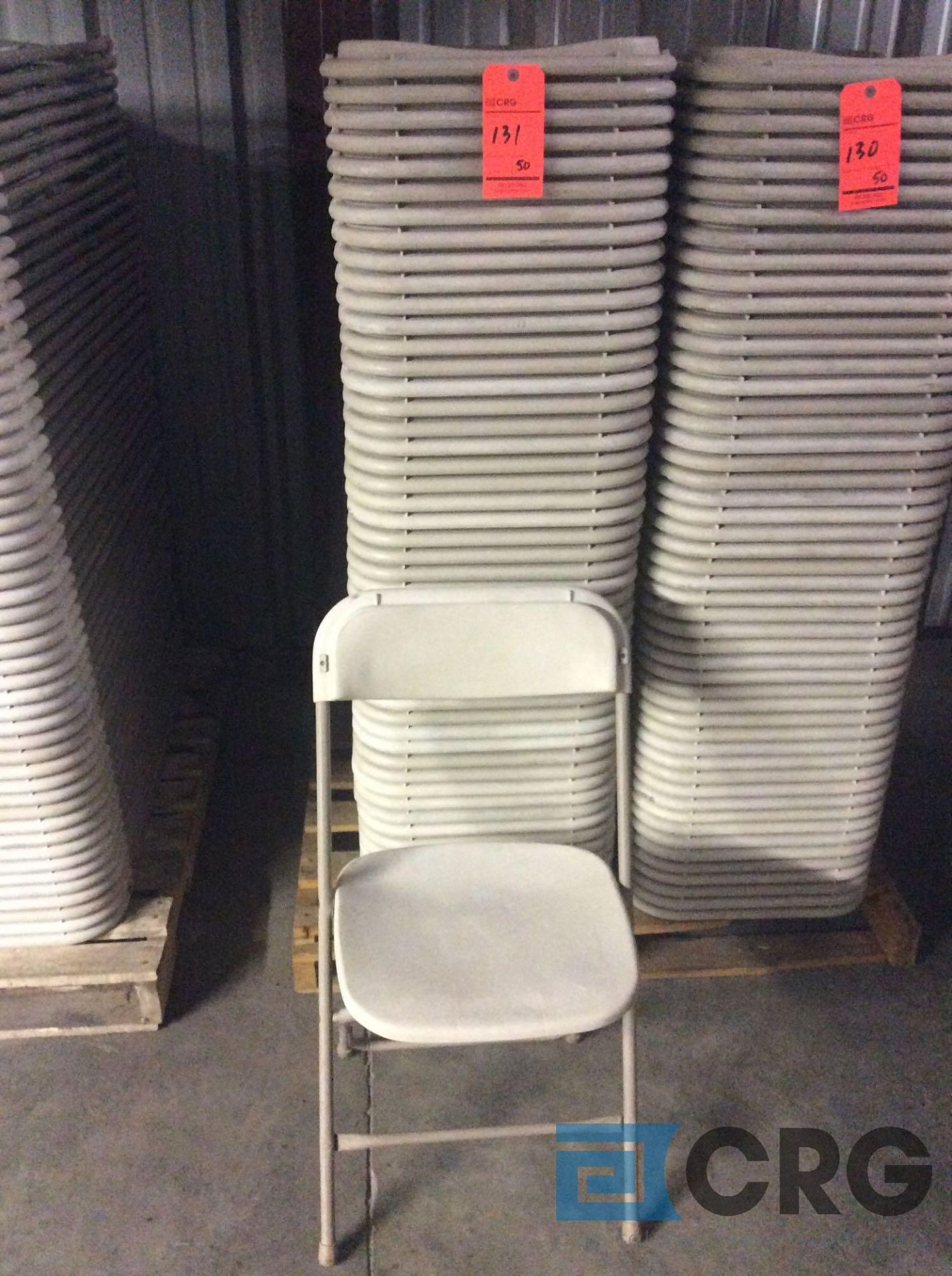 Lot of (50) beige metal / plastic folding stack chairs