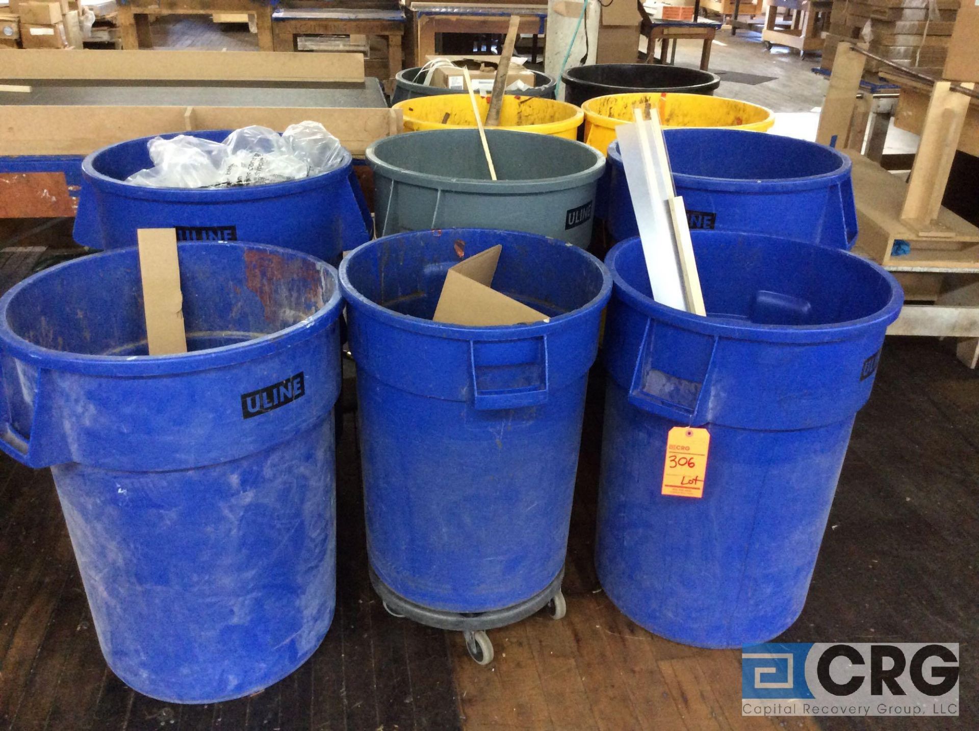 Lot of (4) 1 yd. rolling trash hoppers, (10) Uline 50 gallon trash cans on rolling bases