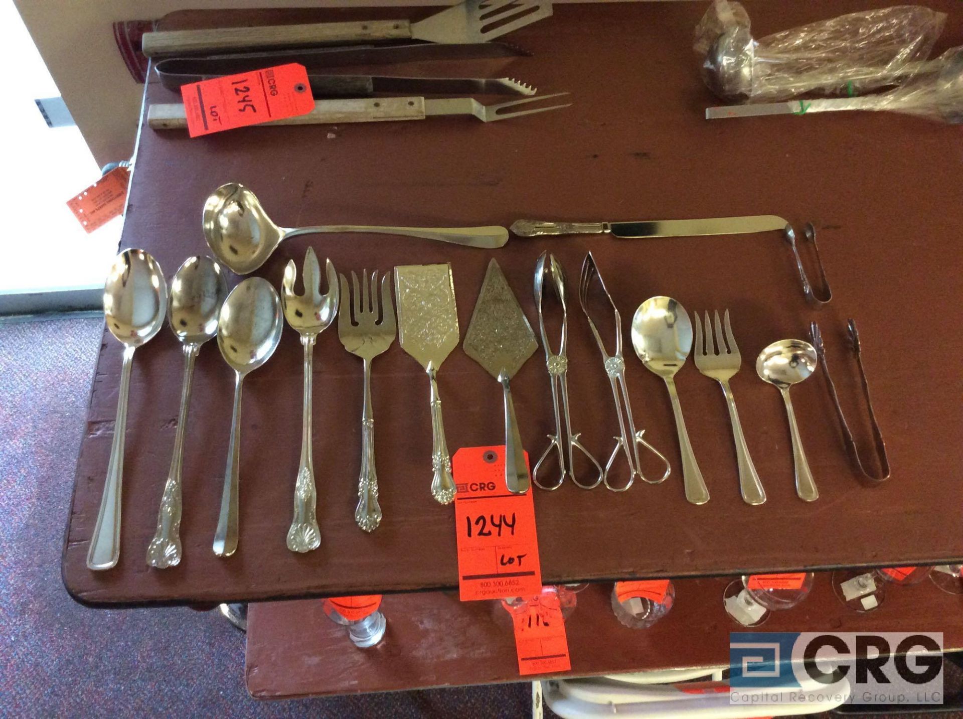 Lot of silverplated serving pieces including (45) long handle serving spoons, (207) long handle