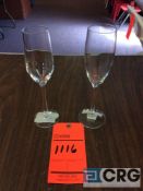 Lot of (1140) 6oz. champagne flute glasses, with (32) racks, add'l $5 fee per rack