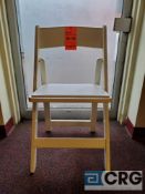 Lot of (100) white wood, padded seat, folding chairs, with storage bags