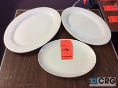 Lot of assorted solid white oval serving platters including (15) 20 in. platters, (62) 18 in.