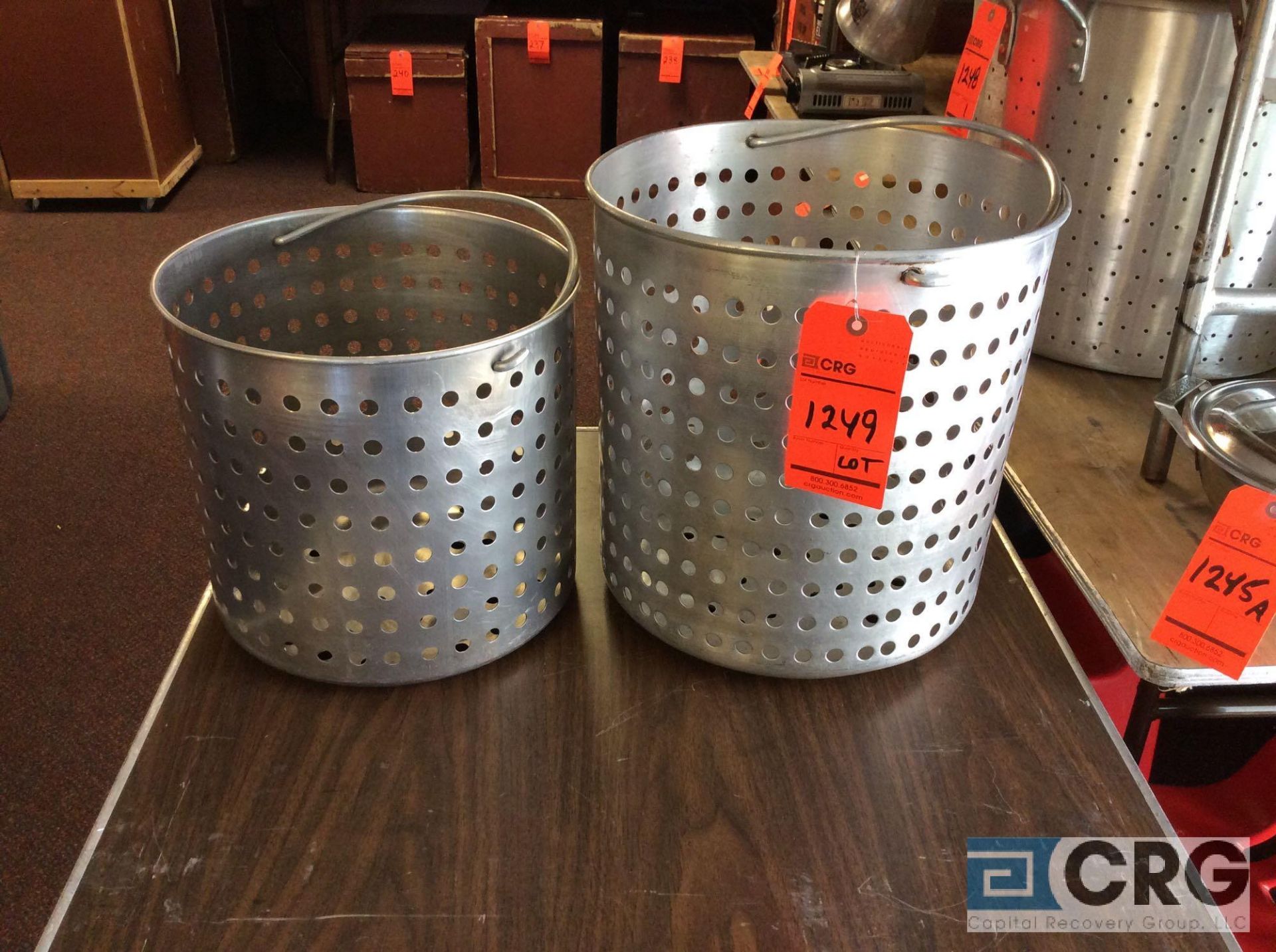 Lot of Dura-Ware strainers; (1) 12.5 diameter and 12 in. high; (1) 14 in. diameter and 15 in. high