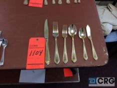 Lot of gold plated pattern flatware including (288) dinner forks, (288) dinner knives, (384) salad/
