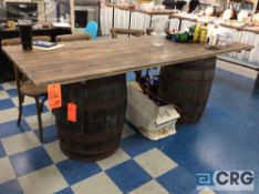 Lot consists of (1) table 36 in. x 8’ and (2) wine barrels