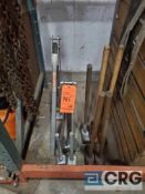 Lot of manual tent lifting brackets, sledge hammers, and stake pullers