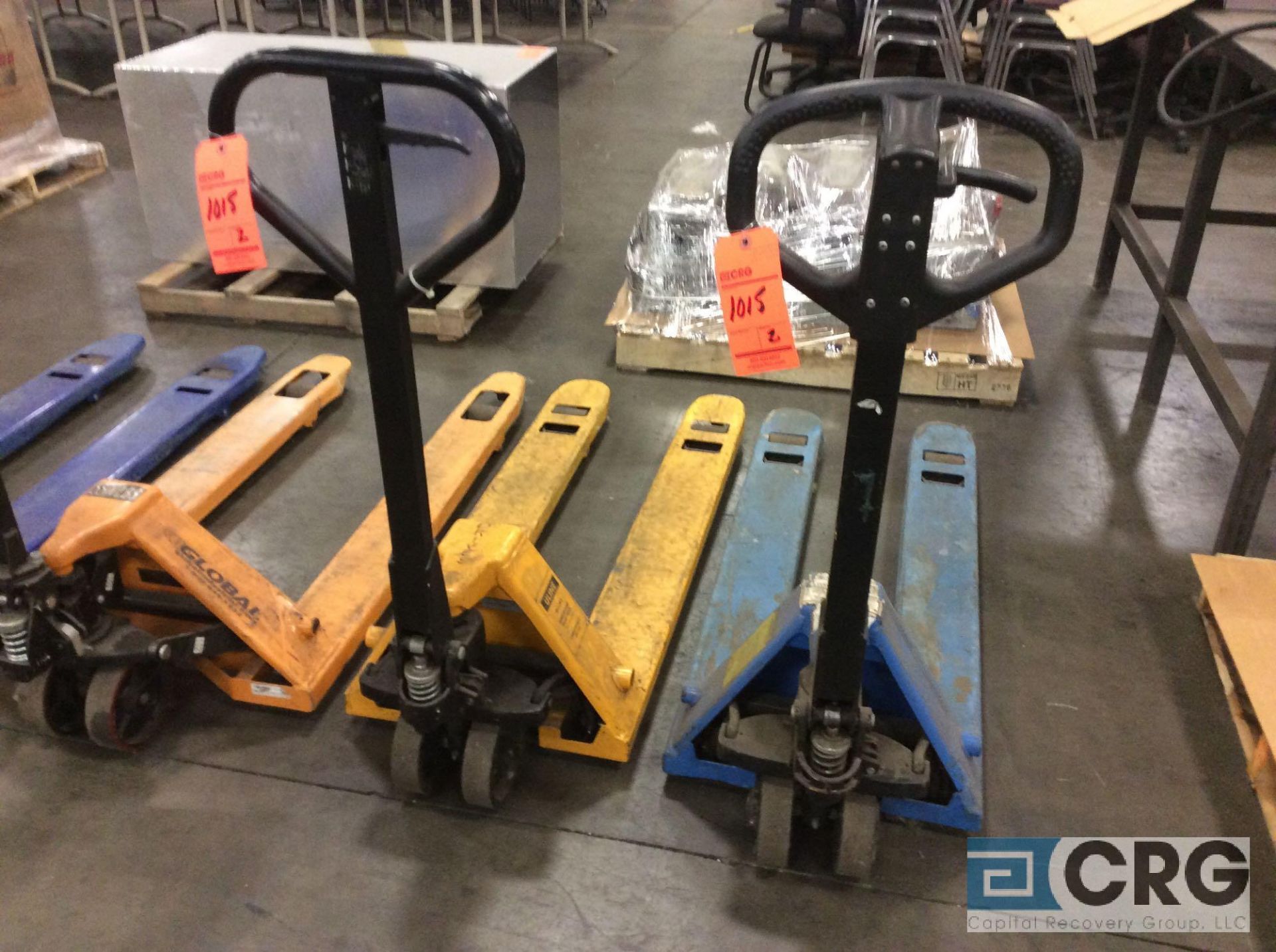 Lot of (2) asst 5000 lb cap narrow fork pallet jacks