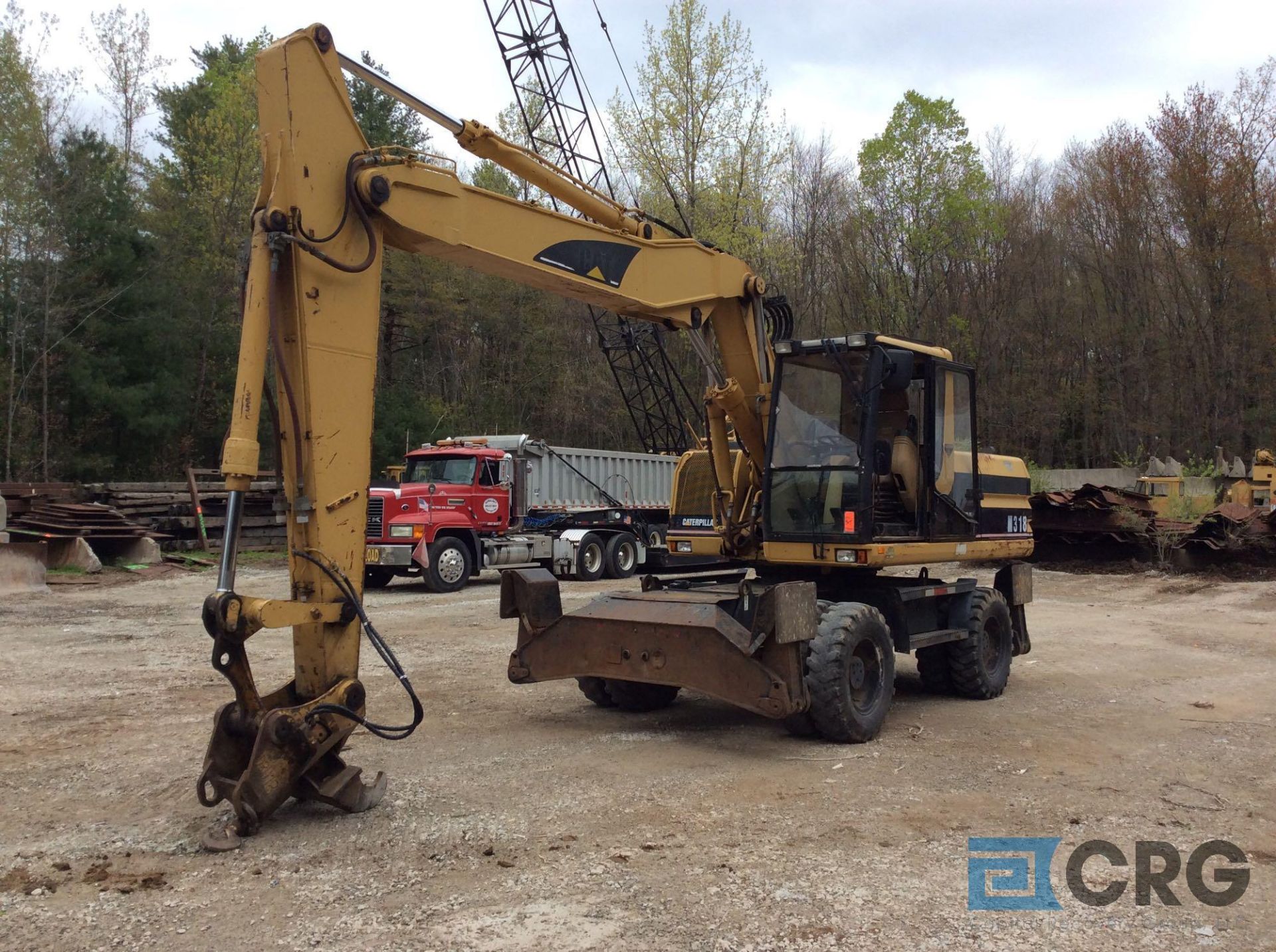 2000 CAT M318 wheel excavator, with WainRay 3 foot wide bucket, outriggers, enclosed cab, dual tires