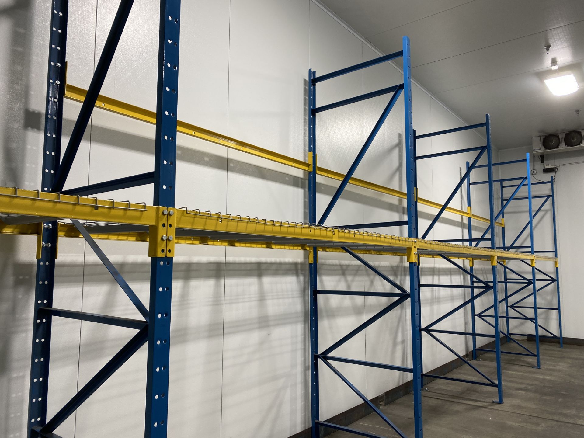 Lot of structural steel pallet racking including (12) 42" X 18' uprights, (20) bolt in 96" cross