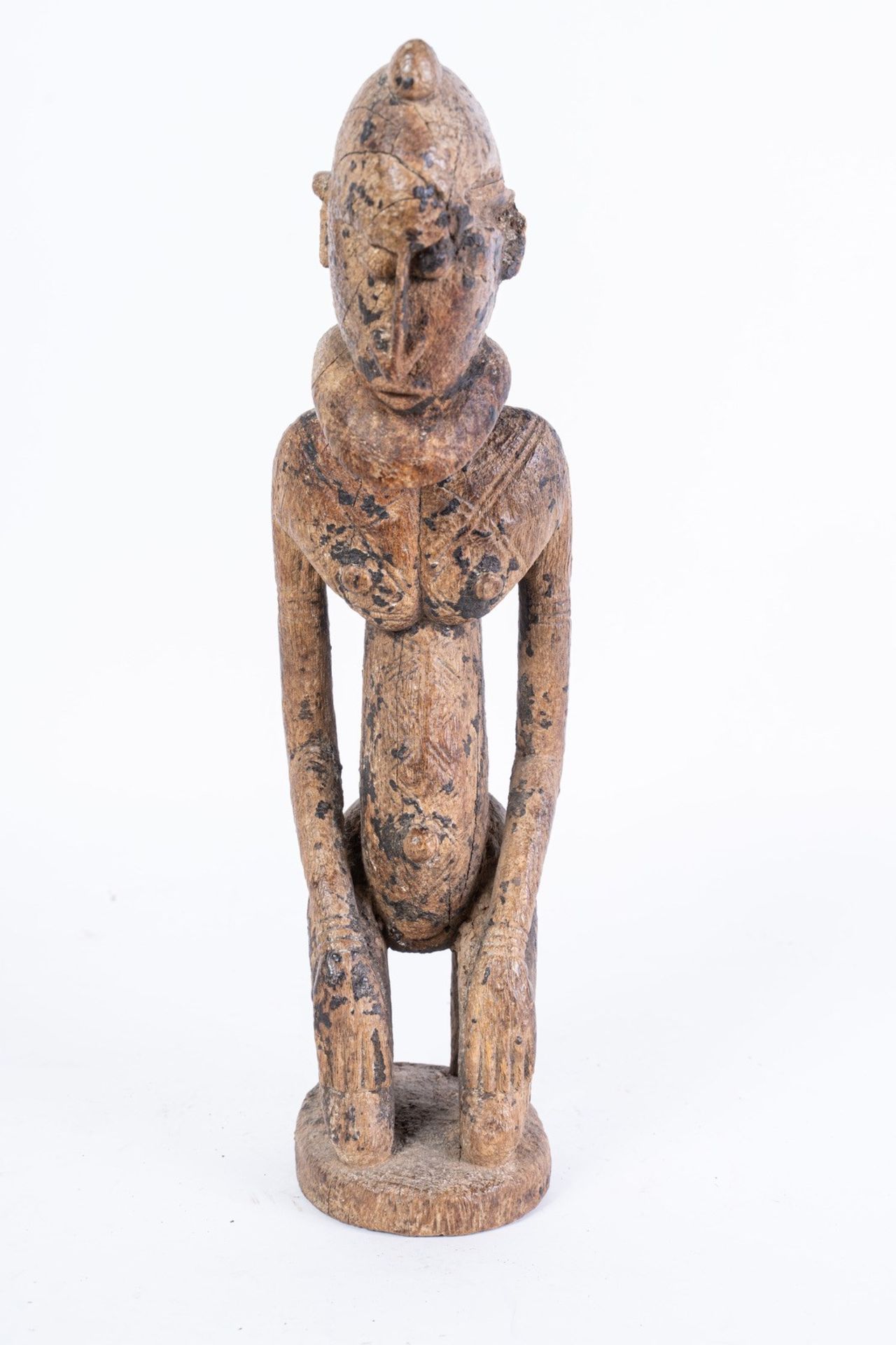 Arte africana Nommo kneeling figure, DogonMali .