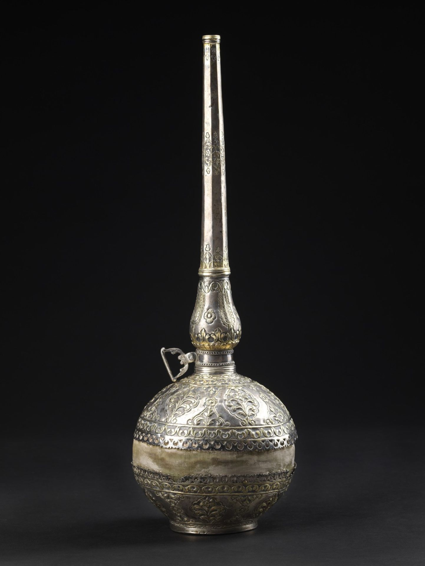 Arte Islamica An embossed silver and silver gilt gun powder bottlePossibly Algeria, 19th century .