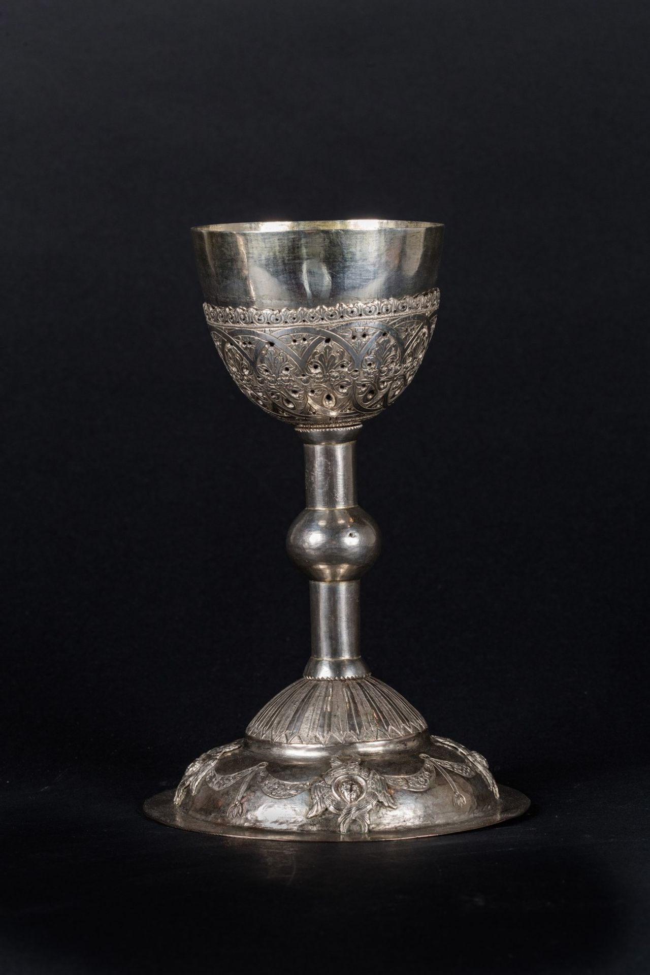 Arte Islamica A Turkish, Armenian or Greek embossed silver chalice .