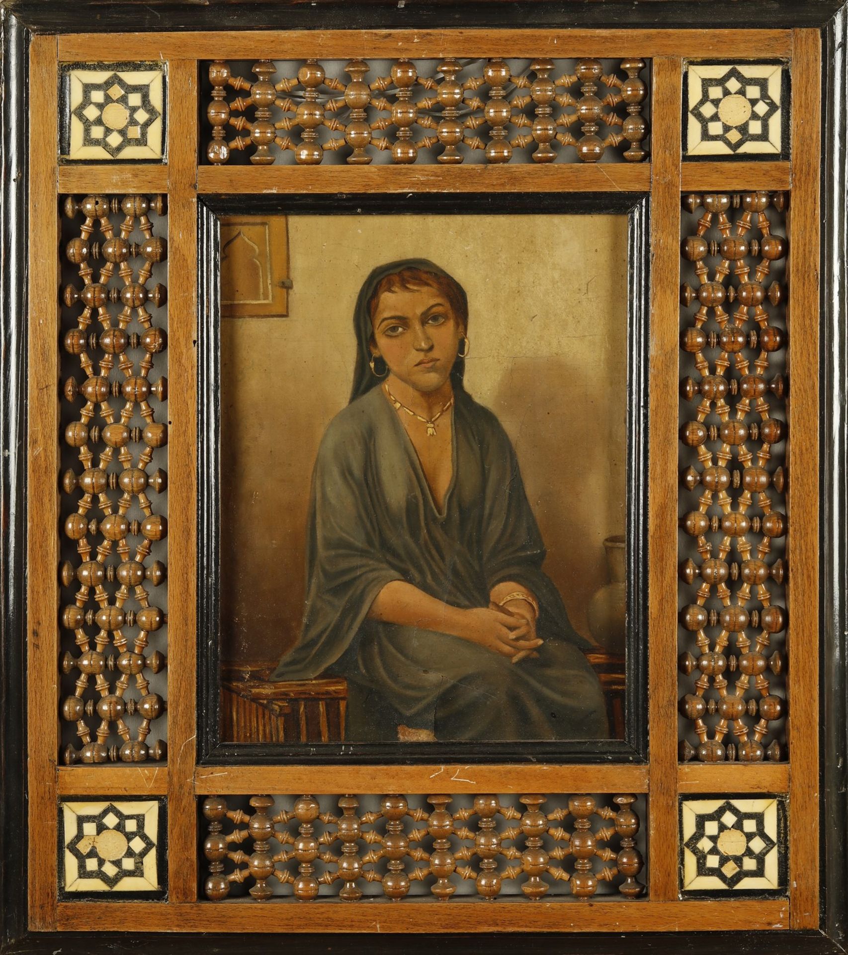 Arte Islamica A woman's portrait within a fretwork wooden frame Oil on cardboard Mid 20th century .