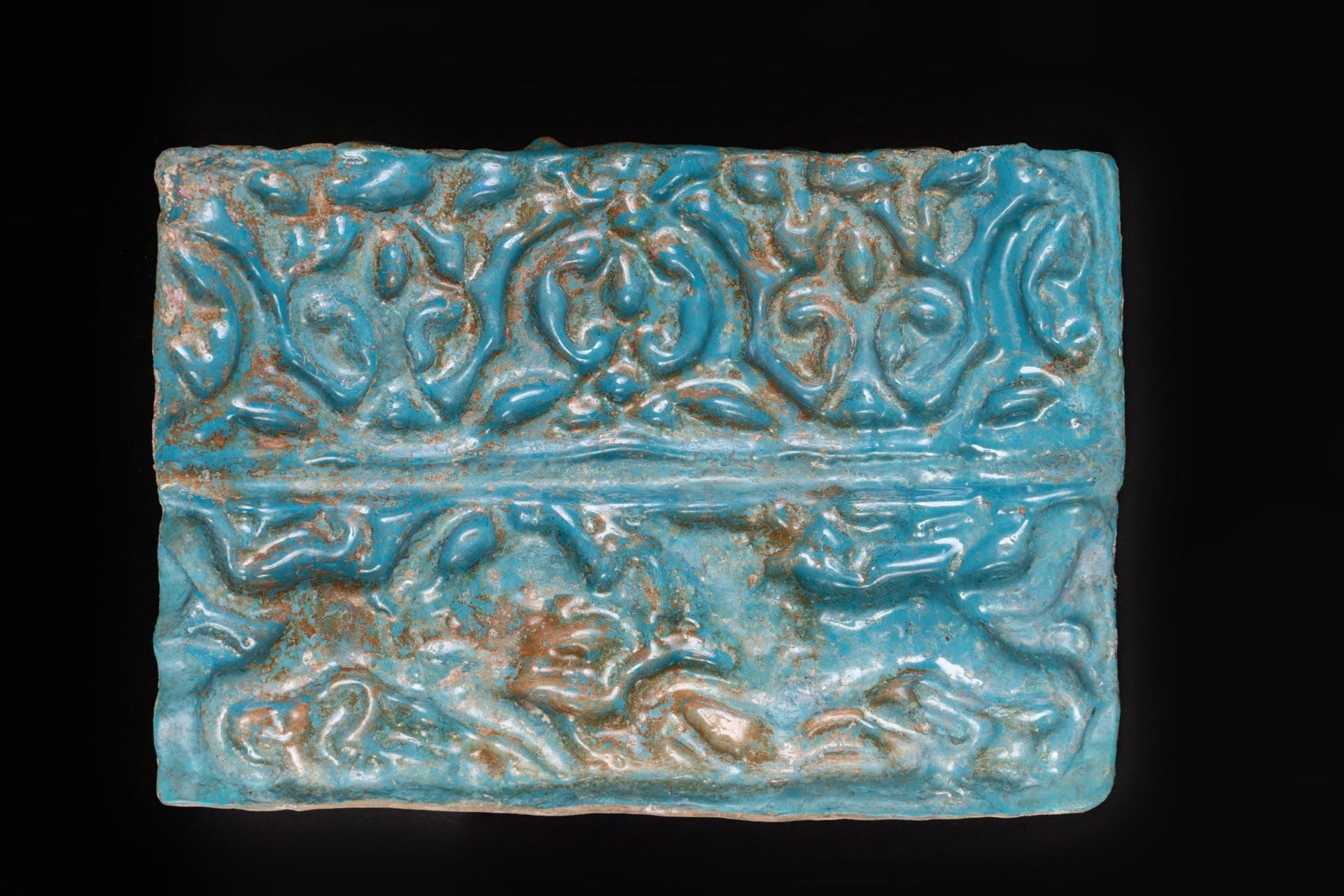 Arte Islamica A turquoise glazed Kashan moulded tile Iran, 12th-13th century .