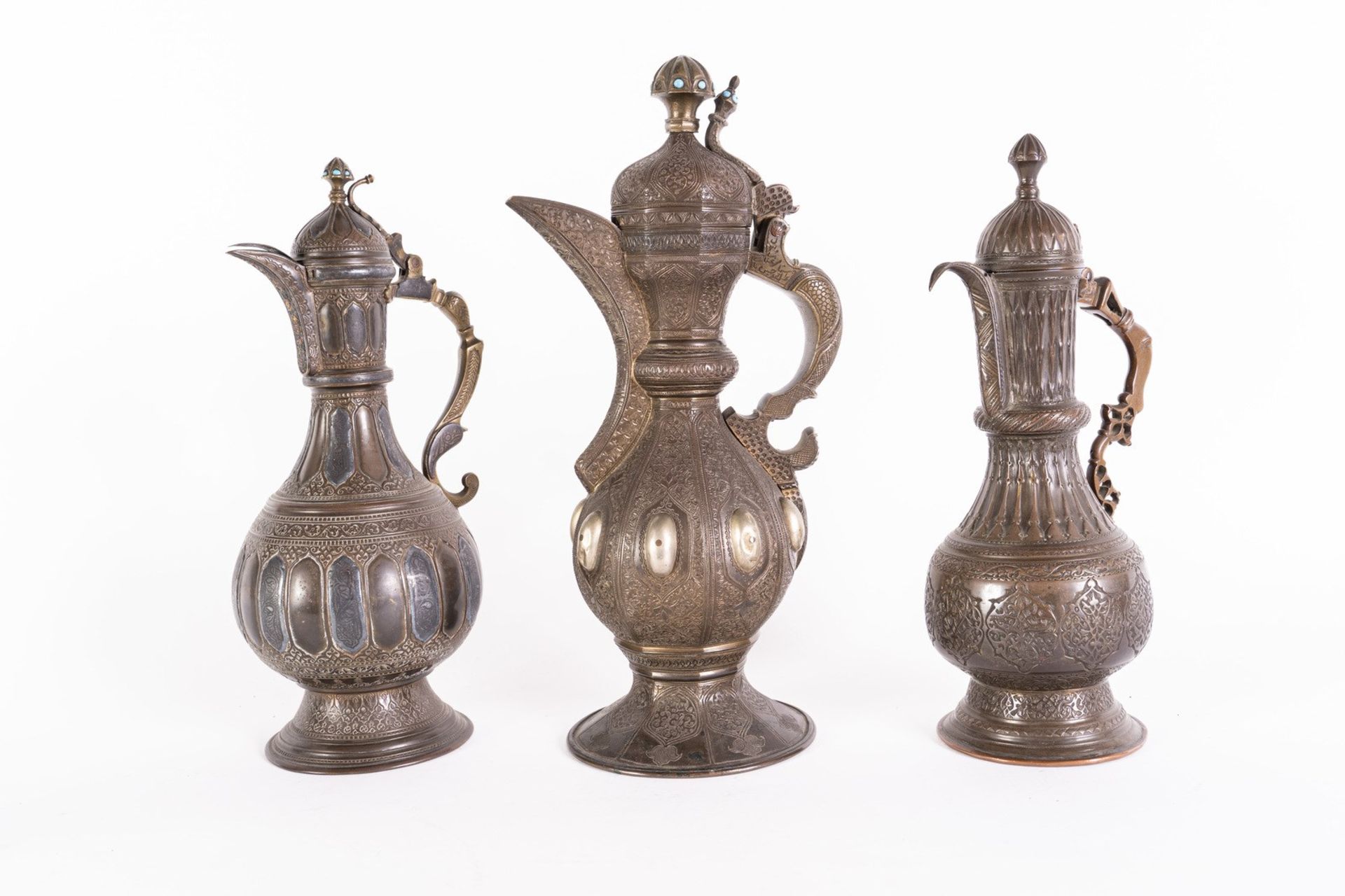 Arte Islamica Three metal coffee jugs.