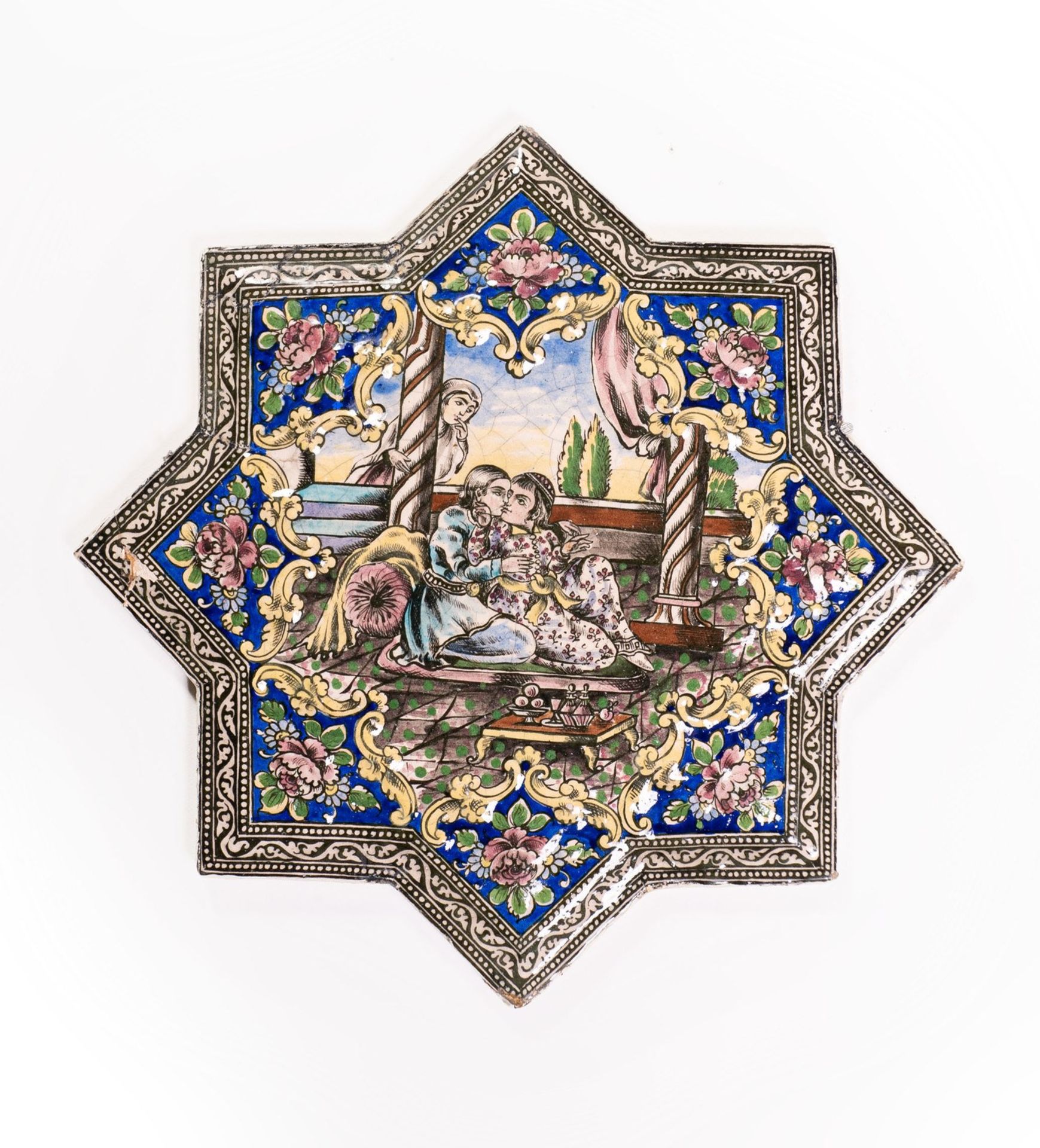 Arte Islamica A Qajar moulded star tile painted with a loving couple Iran, 19th century .