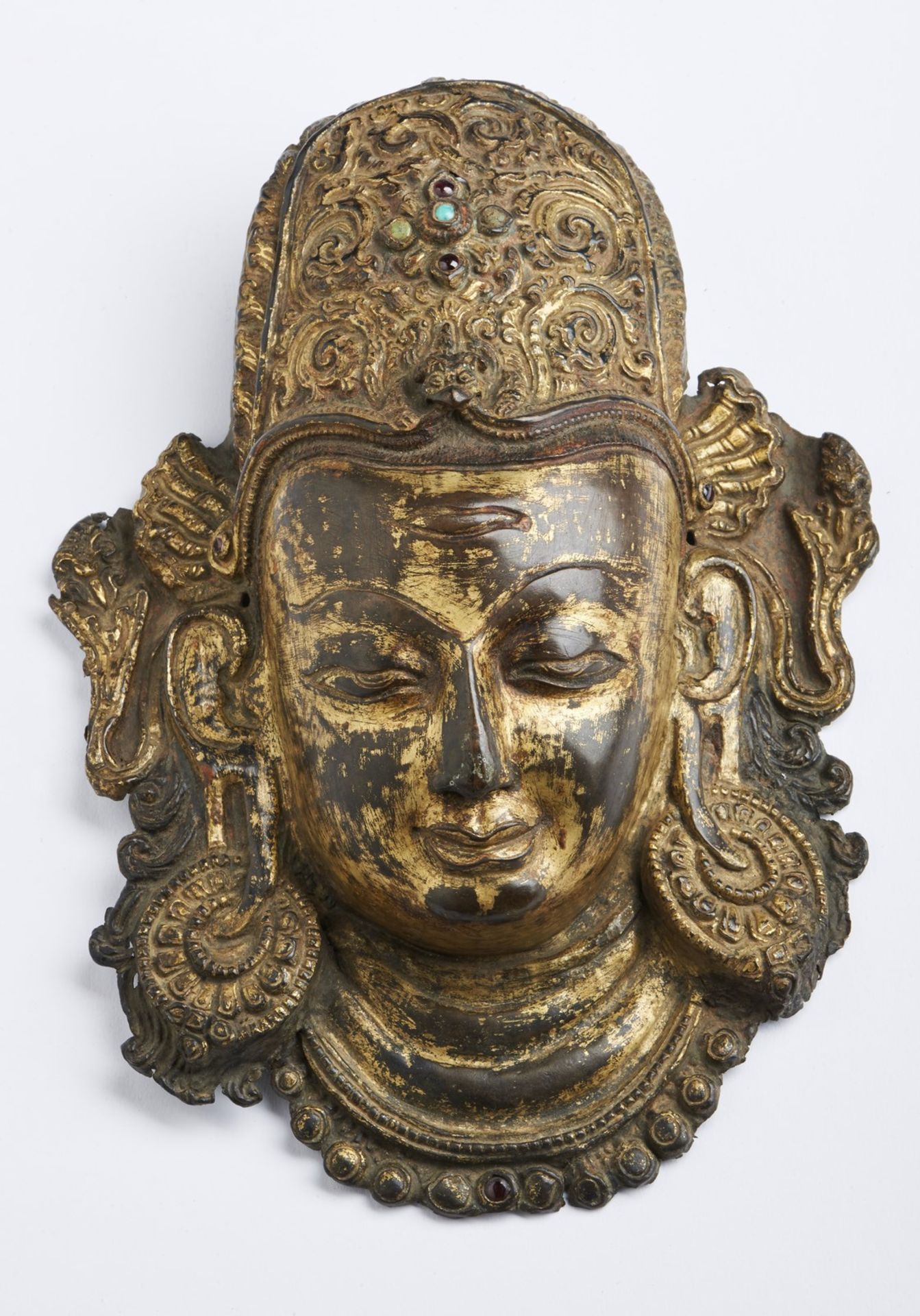 Arte Himalayana A copper embossed Indra head Nepal, 14th-15th century .