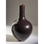 Arte Cinese A monochrome aubergine vase bearing a spurious Ming mark at the base China, 20th centur