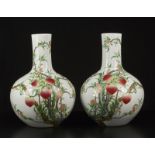 Arte Cinese A pair of tianchuping porcelain vases painted with peaches and bearing a Qianlong six c