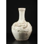 Arte Cinese A large white porcelain vase with applied decoration depicting a dragon chasing the fla