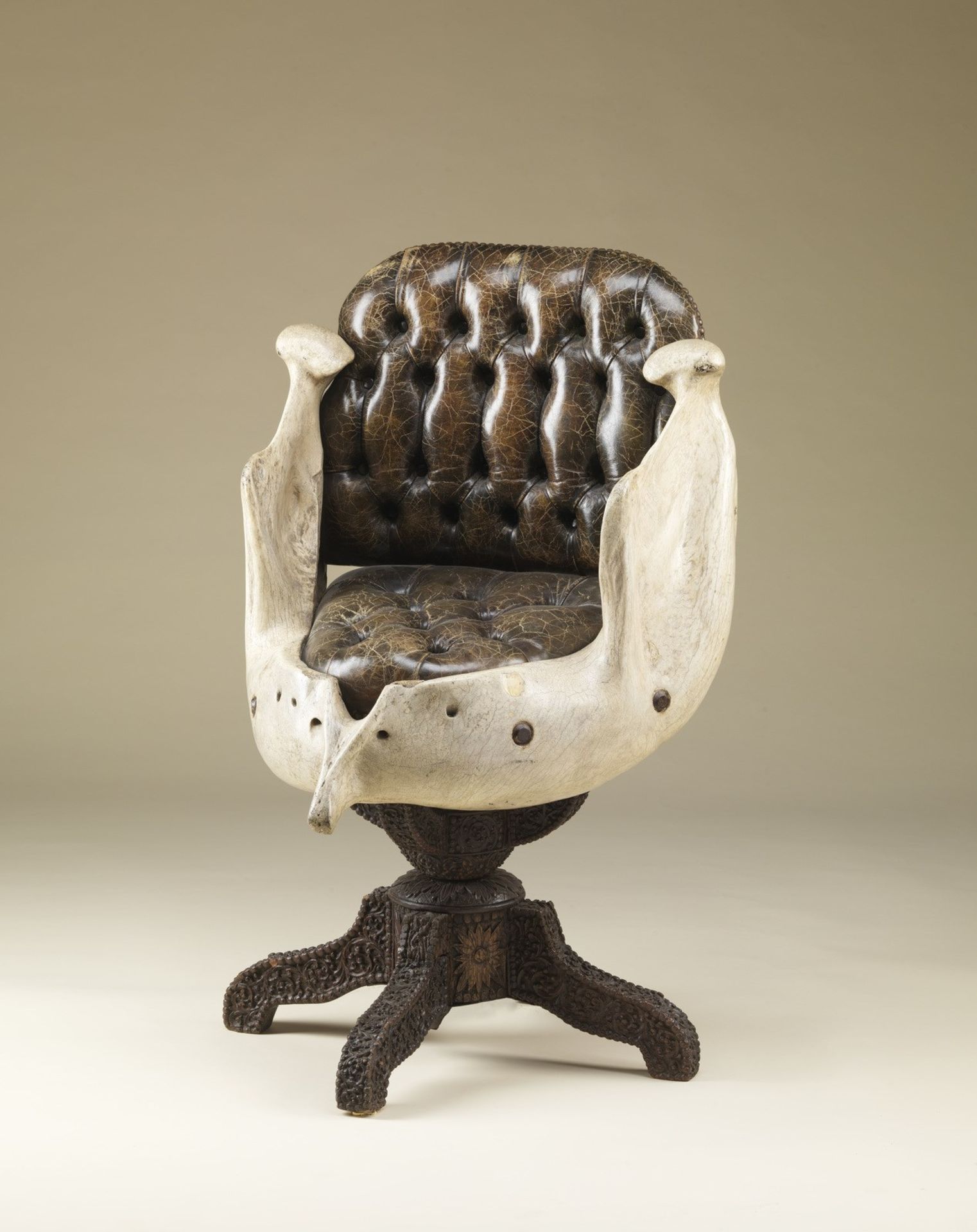 . A swivel armchair with elephant jaw England, 19th century .