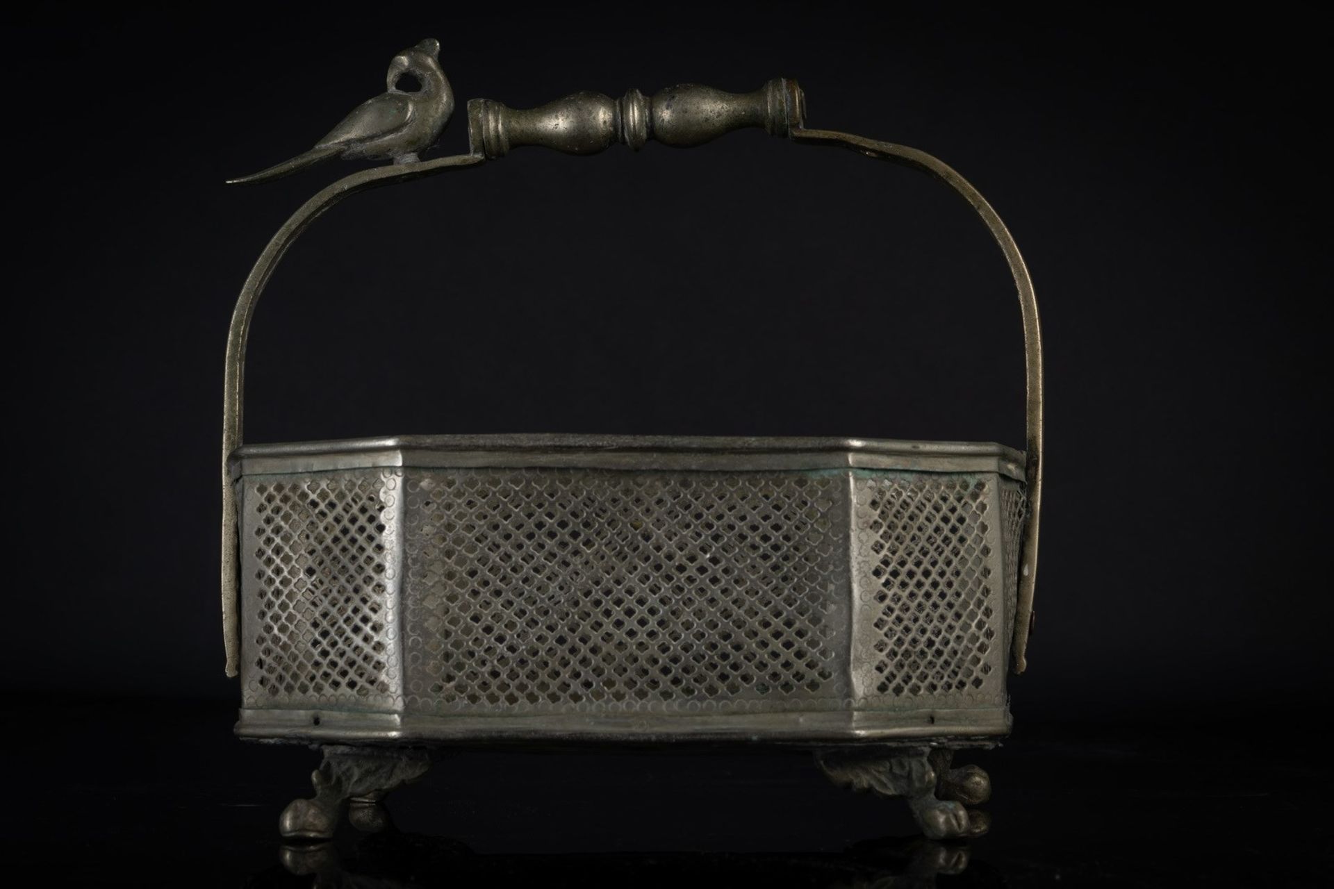 Arte Indiana A metal fretwork fruit basket India, 19th century .