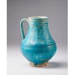 Arte Islamica A large Kashan turquoise glazed ewerIran, late 12th - early 13th century .