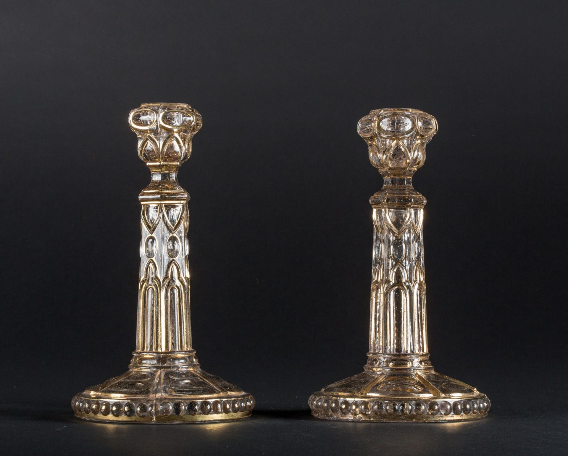 Arte Islamica A pair of Beykoz gilt glass candlesticks Turkey, Beykoz, 19th century .