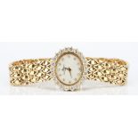 18K Baume & Mercier watch with Diamond Surround