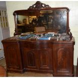 A Victorian mahogany sideboard, with a mirrored back, central drawer and two pairs of cupboard