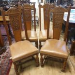 A set of four Arts & Crafts style carved oak dining chairs (4)