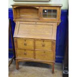 An Arts & Crafts oak bureau cabinet, 92 cm wide Lacks three quarter gallery to top.